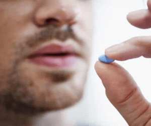 Man takes Viagra pill